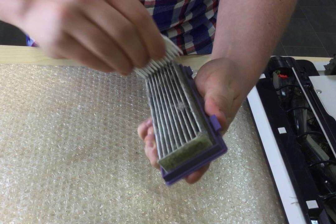 cleaning neato filter.jpg