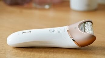 First epilator with S-shaped handle