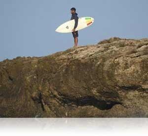 Nikon COOLPIX P900 photo of a surfer highlighting 83x Optical Zoom.